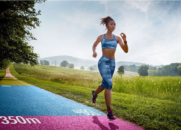 Landscaped running track with Triflex color and design surfaces in an outdoor setting