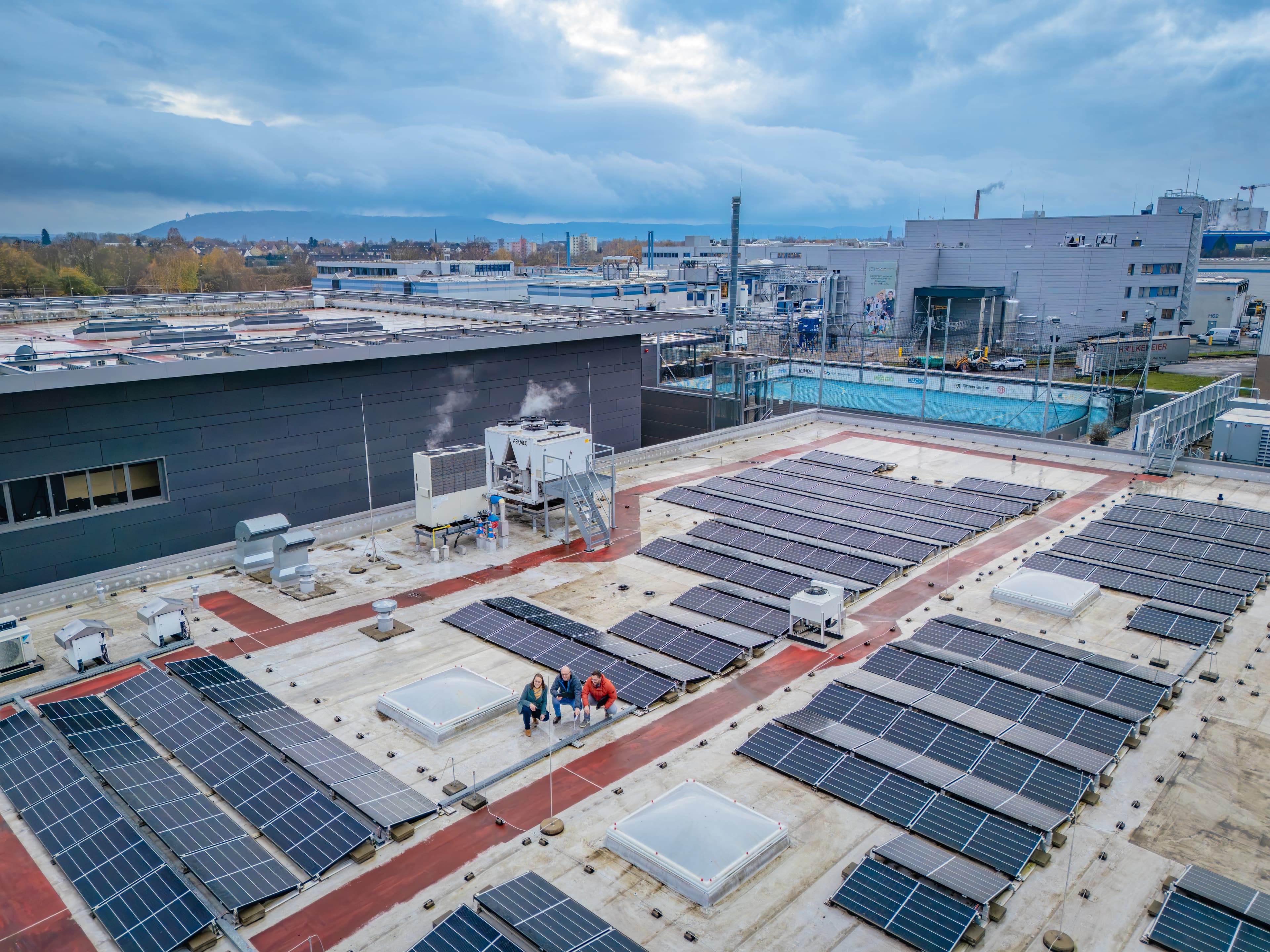 Industrial facility with a large industrial roof and technical structures